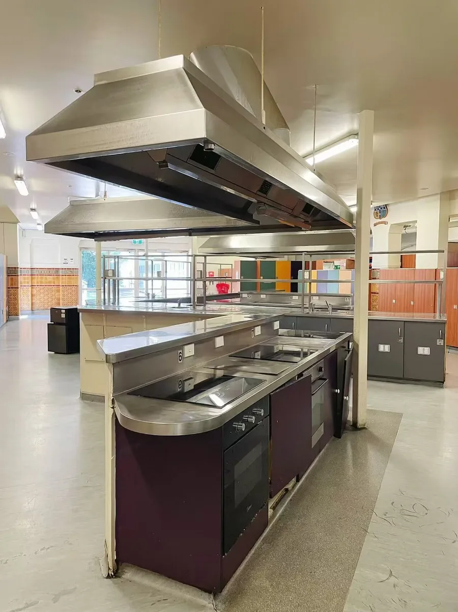 Shared cooking kitchen with ovens and stainless-steel worktops